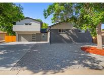 Modern two-story home with gray exterior, updated garage, and landscaped yard at 181 E 108Th Ave, Northglenn, CO 80233