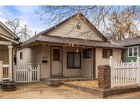 Charming single-story home featuring a cozy front porch and well-kept landscaping at 2515 Ames St, Edgewater, CO 80214