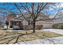 Charming single-Gathering home featuring a manicured lawn and a well-maintained exterior at 1853 S Marshall Cir, Lakewood, CO 80232