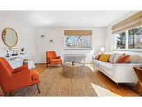 Bright living room with hardwood floors, neutral walls, and stylish furnishings at 525 Jackson St # 303, Denver, CO 80206