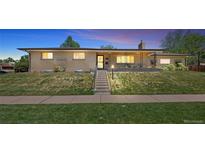 Charming single-story home with a well-maintained front yard, steps leading to the front porch, and inviting curb appeal at 2501 E Arkansas Ave, Denver, CO 80210