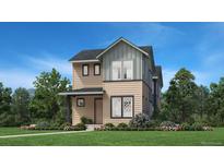 Charming two-story home featuring a manicured lawn, well-placed shrubbery and a covered porch, perfect for curb appeal at 858 Promenade Dr, Superior, CO 80027