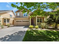 Charming two-story home featuring a well-maintained lawn and inviting front porch at 17332 E Lake Ln, Aurora, CO 80016