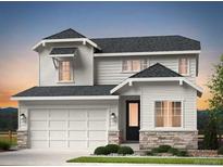 Charming two-story home with stone accents, a covered porch, and an attached two-car garage at 3341 N Buchanan Way, Aurora, CO 80019