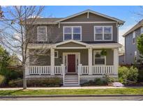 Charming two-story home featuring a welcoming front porch and well-maintained landscaping at 3476 Beeler Ct, Denver, CO 80238