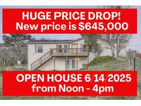 Split level home featuring a large price drop, open house, lower level entrance, and a deck with stairs at 1062 Pinon Ln, Elizabeth, CO 80107