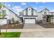 Charming home featuring a two-car garage, neutral paint scheme, and low maintenance landscaped front yard at 19039 E 94Th Pl, Commerce City, CO 80022