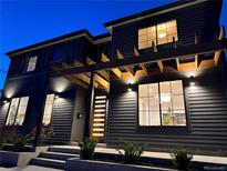 Stunning two-story home exterior featuring modern design and architectural lighting and wooden pergola at 3649 W 21St Ave, Denver, CO 80211
