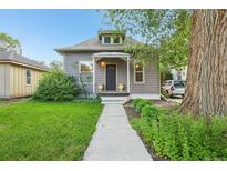 Charming home featuring well-maintained landscaping, sidewalk and inviting front entrance at 422 Atwood St, Longmont, CO 80501