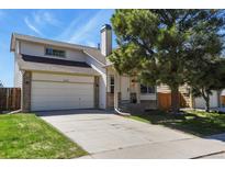 Charming two-story home with a brick and siding exterior and a well-maintained front yard at 265 N Holcomb St, Castle Rock, CO 80104