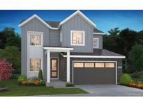 Charming two-story home with gray siding, brick accents, and a two-car garage at 1288 Stillspring Ln, Castle Pines, CO 80108