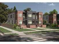 Modern townhouse complex with brick and metal siding, landscaping, and inviting entryways at 1995 S High St, Denver, CO 80210