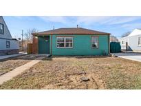 Charming single-story home featuring a quaint front porch and natural light, with a minimalist yard at 1730 W 51St Ave, Denver, CO 80221