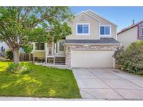Charming two-story home featuring stone accents, neutral siding, and a well-maintained front yard at 11481 King St, Westminster, CO 80031