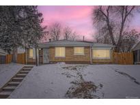 Charming brick home with a well-maintained lawn and cozy appeal at 2280 W Center Ave, Denver, CO 80223