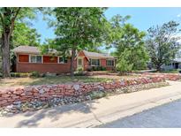 Charming brick home featuring mature trees, and a well-maintained front yard at 760 S 42Nd St, Boulder, CO 80305