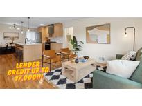 Bright living room with hardwood floors, modern furniture, and an open floor plan at 2812 N Harrison St, Denver, CO 80205