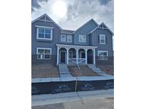 Charming, two-story home featuring a cozy front porch and eye-catching architectural design at 15277 Fillmore St, Thornton, CO 80602