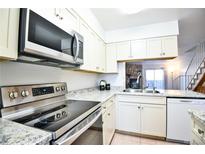 Modern kitchen with stainless steel appliances and granite countertops at 1641 S Idalia Cir # F, Aurora, CO 80017