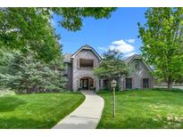 Charming home featuring an inviting walkway and well-maintained lawn at 32 Glenmoor Dr, Englewood, CO 80113