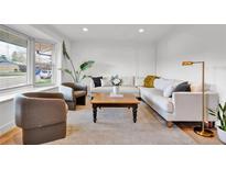 Bright living room featuring neutral tones, contemporary furniture, and stylish decor for a welcoming atmosphere at 4262 E Fremont Pl, Centennial, CO 80122