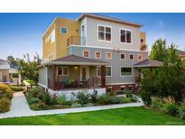 Stunning multi-story home featuring a covered front porch, a mix of modern colors, and professional landscaping at 1231 Cedar Ave, Boulder, CO 80304