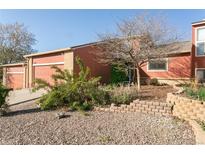 Charming home featuring a two-car garage, brick accents, and a well-maintained front yard at 2901 W Rowland Ave, Littleton, CO 80120