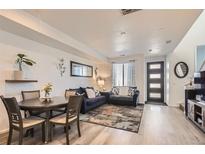 Inviting living room with modern furniture, stylish decor, and light wood floors for a cozy, contemporary feel at 5332 13Th St, Frederick, CO 80504