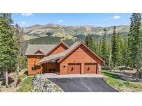 Charming mountain home with a two-car garage and stunning views of the surrounding landscape at 384 Camron Ln, Breckenridge, CO 80424