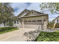 Charming home featuring a two-car garage, well-maintained lawn, and lovely curb appeal at 17059 Motsenbocker Way, Parker, CO 80134