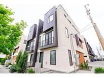 Modern townhome showcasing sleek architectural design and contemporary color palette on a sunny day at 3404 W 18Th Ave, Denver, CO 80204