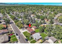 Aerial view of house and surrounding neighborhood, showcasing the property's location and setting at 6087 W 61St Pl, Arvada, CO 80003