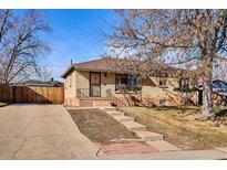 Charming brick home with a well-maintained lawn and inviting front entrance at 2555 S Tennyson Way, Denver, CO 80219