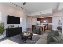 Open-concept living room flows into a modern kitchen with stainless steel appliances and stylish furnishings at 2460 W 29Th Ave # 303, Denver, CO 80211