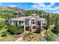 Expansive home boasts multiple balconies to enjoy mountain views at 16134 Sandstone Dr, Morrison, CO 80465