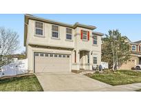 Charming two-story home with a two-car garage and landscaped front yard at 5072 Cathay St, Denver, CO 80249