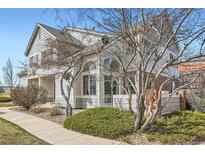 Charming townhome with well-kept landscaping and a sidewalk leading to the entrance at 9573 Deerhorn Ct # 19, Parker, CO 80134