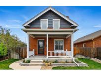 Charming brick home with a welcoming front porch and well-maintained landscaping at 2716 N Columbine St, Denver, CO 80205