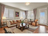 Inviting living room with plentiful natural light, neutral tones, and stylish furnishings at 4205 E Iliff Ave # 5, Denver, CO 80222