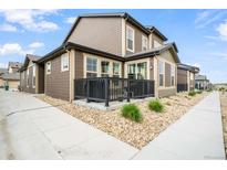 Charming two-story home with a cozy front porch and low maintenance rock landscaping at 11524 Dewey St, Parker, CO 80138