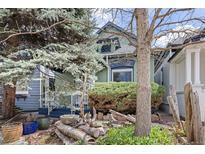 Charming home exterior with mature trees and landscaping that provides wonderful curb appeal at 2514 N Humboldt St, Denver, CO 80205