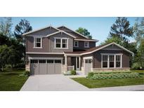 Charming two-story home with a three car garage and professionally landscaped yard at 85 Wooten Ave, Brighton, CO 80601