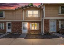 Charming brick townhouse featuring a well-maintained exterior and inviting entrance at 1534 S Ouray Cir # B, Aurora, CO 80017