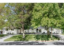 Charming single-story home with manicured lawn and mature trees providing ample shade at 3901 S Dexter St, Cherry Hills Village, CO 80113
