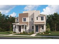 Modern two-story townhomes featuring stone accents, complementary siding, and inviting covered front entrances at 17035 E Alameda Pkwy, Aurora, CO 80017