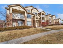 Charming condo complex with brick accents and private balconies in a desirable neighborhood at 5714 N Gibralter Way # 5-306, Aurora, CO 80019