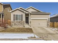 Charming single-Gathering home featuring stone accents and a two-car garage at 529 Vista Blvd, Lochbuie, CO 80603