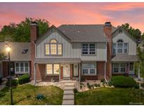 Charming townhome boasts a well-maintained lawn, brick accents, and a cozy, inviting entrance at 9676 W Chatfield Ave # B, Littleton, CO 80128