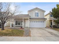 Charming two-story home featuring a covered porch and a two-car garage, perfect for Gathering living at 4865 Gibraltar St, Denver, CO 80249