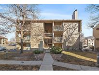 Inviting multi-story condo building featuring private balconies, tidy landscaping, and a welcoming entrance at 4068 S Atchison Way # 301, Aurora, CO 80014